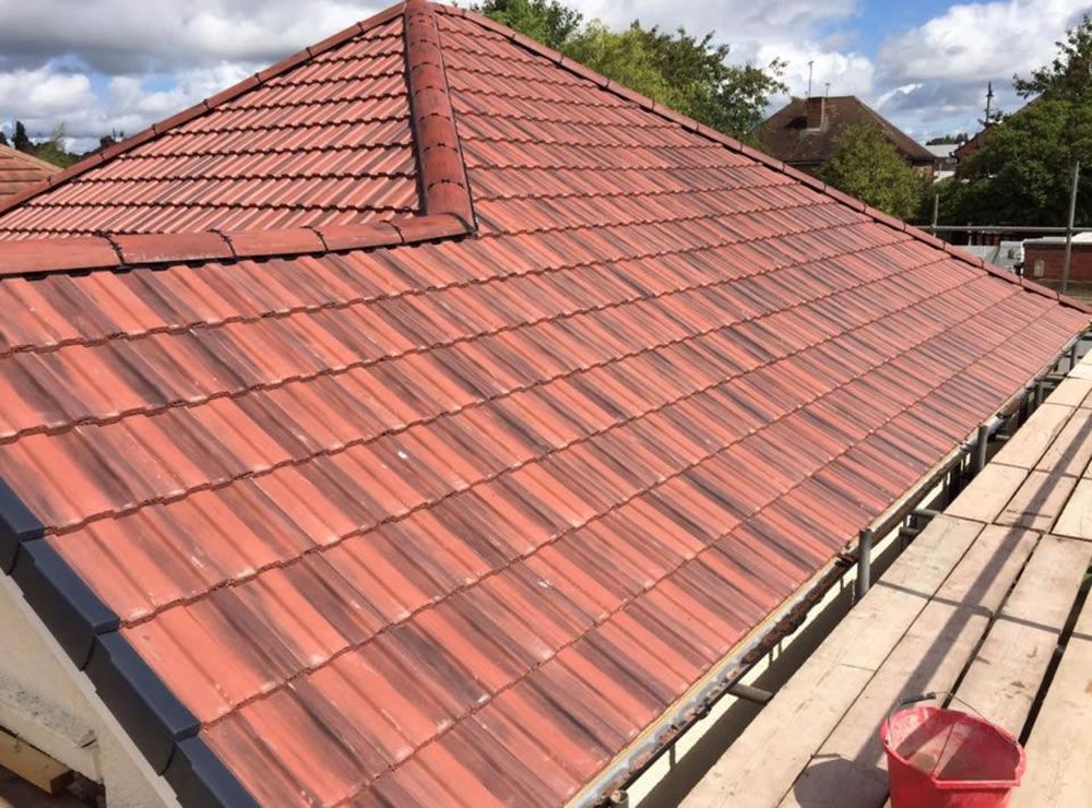 Completed interlocking tile roof with hip detail