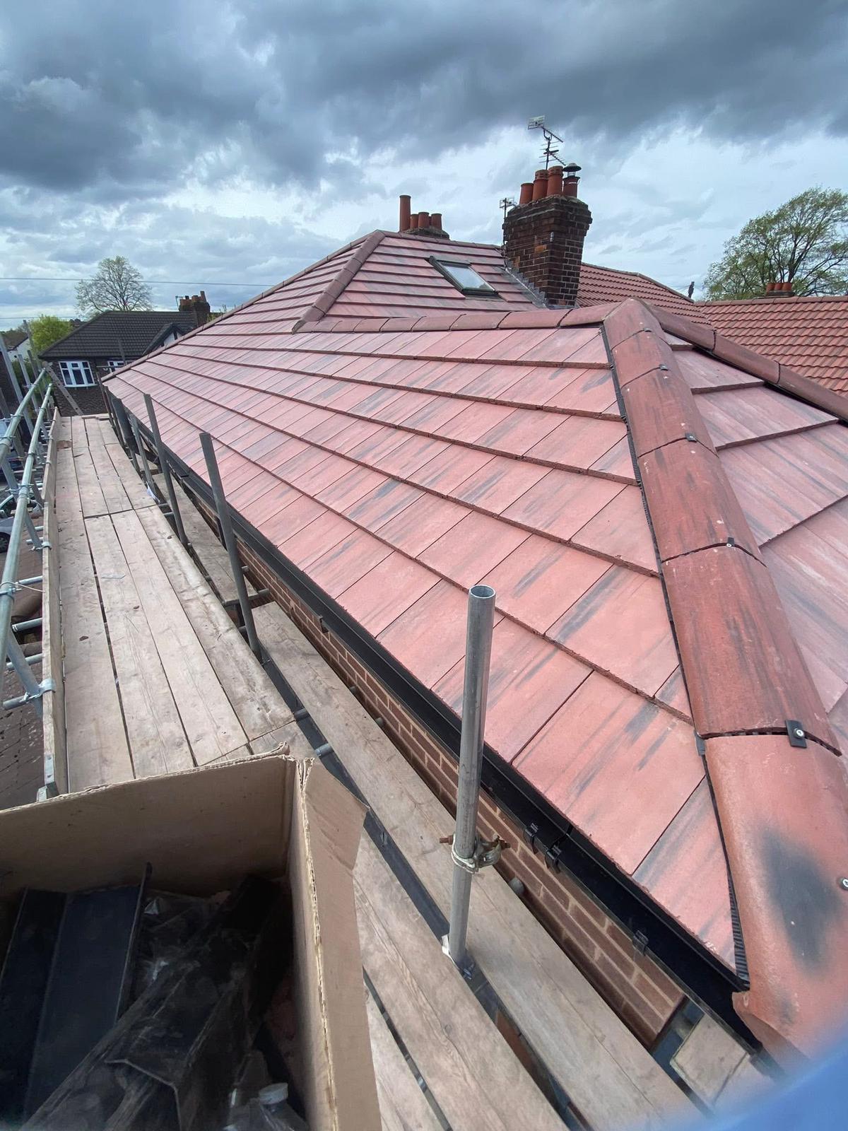 Full roof replacement with plain tiles and hip detail with scaffolding